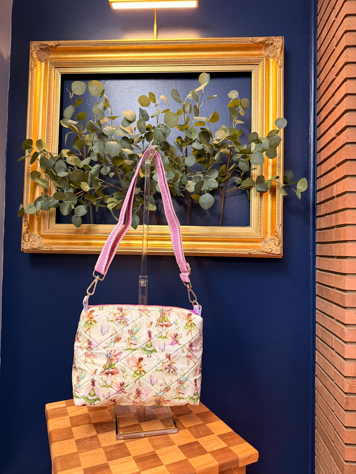 Quilted crossbody bag in storybook fairy print with pink woven strap