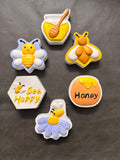 Hand-painted bee and honey designs: honey pot, smiling bee, honey dipper and more