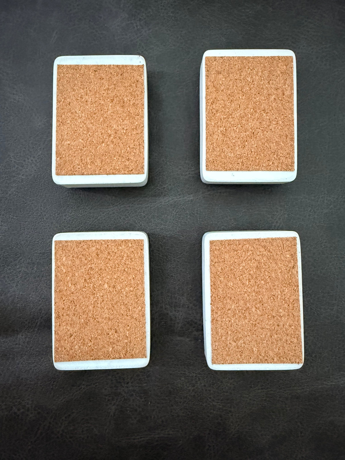 Cork bottoms of the hand-painted fabric weights