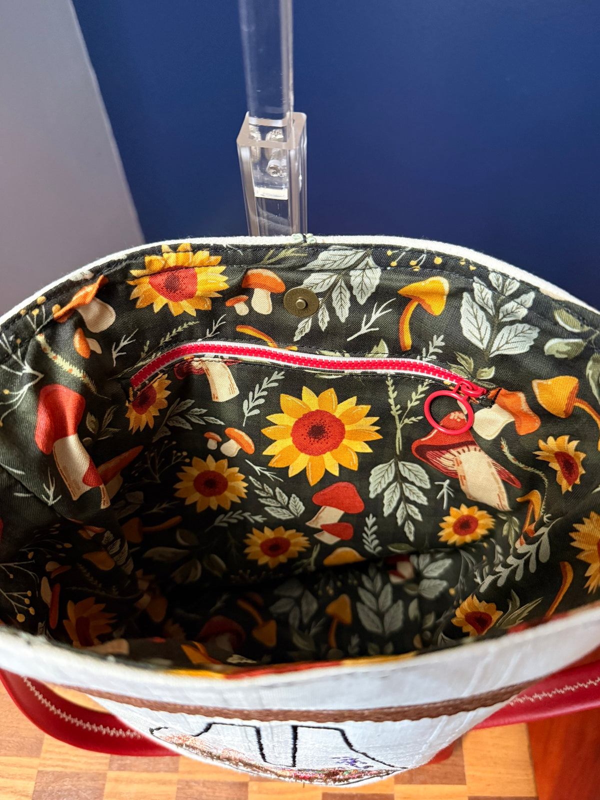 Mushroom and sunflower cotton interior with zipper pocket and magnetic snap