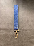 Keychain wristlet in blue medallion floral fabric with gold hardware