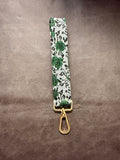 Keychain wristlet in emerald tapestry floral fabric with gold hardware