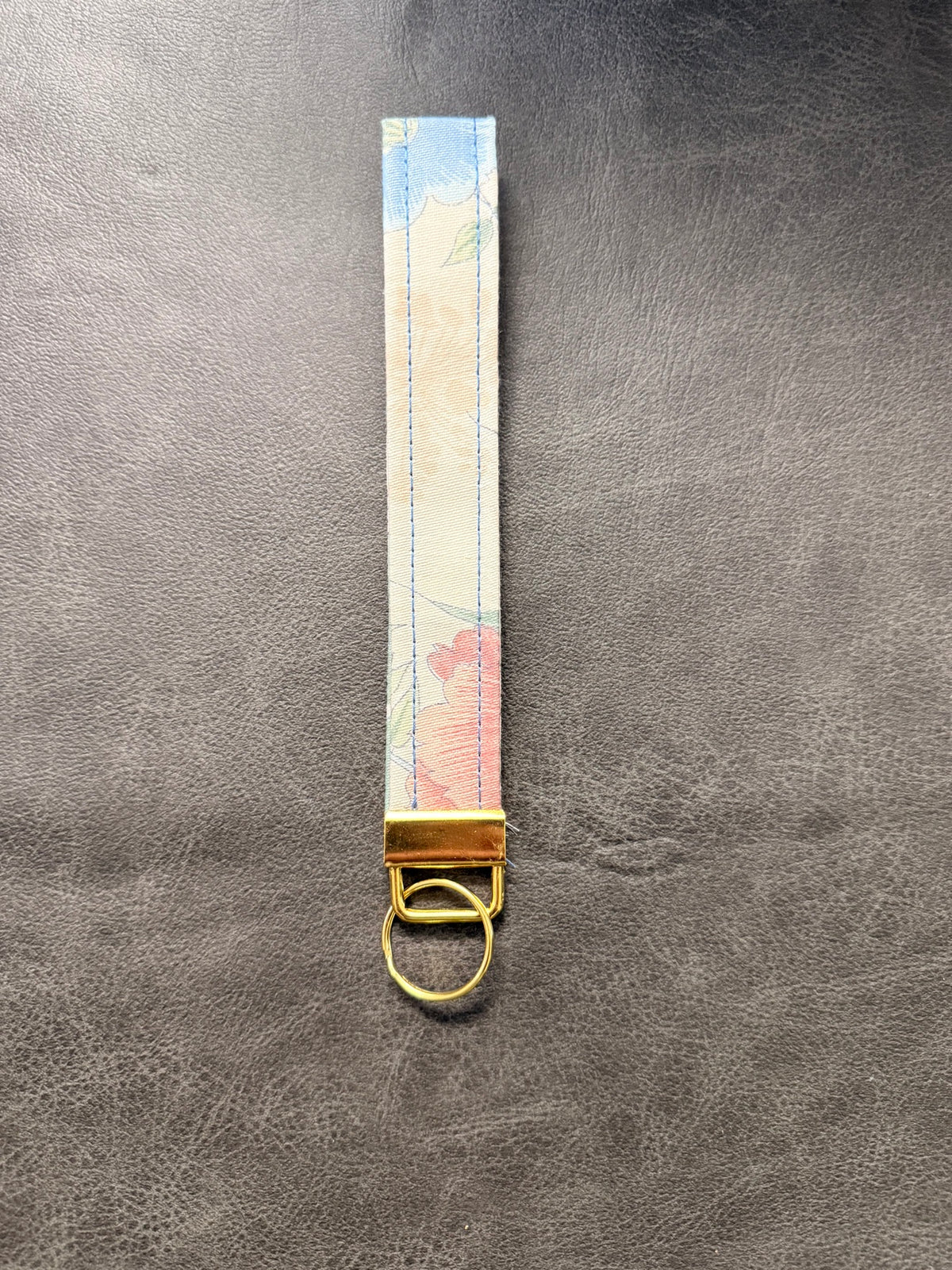 Keychain wristlet in pastel watercolor floral fabric with gold hardware